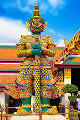 Fototapeta na wymiar Giant statue at Temple of the Emerald Buddha, Wat phra kaew, Grand palace, Bangkok, Thailand