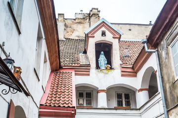 Small courtyard with a sculpture of Maria old town Vilnius Lithuania