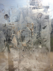 Fototapeta na wymiar Dirty window glass. Urban abstract composition. Close up shot.