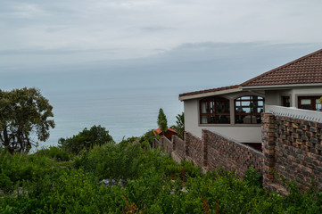 Fototapeta na wymiar House on a Cliff with Ocean View in Knysna, Garden Route, Western Cape, South Africa