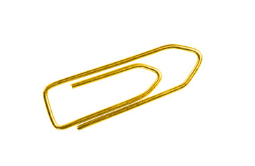Golden grounge  paper clip isolated on white background close up