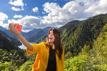 Young beautiful long hair woman making emotional selfi