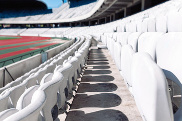 Stadium seats in daylight.