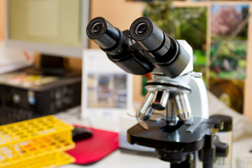 Fototapeta na wymiar Trinocular microscope in a modern medical or research laboratory. Shot in natural light.