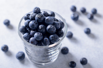 Glass of fresh blueberries