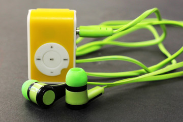 Green player and beautiful headphones