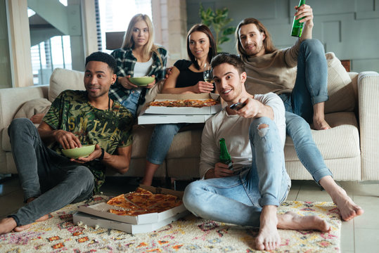Image of five friends watching TV