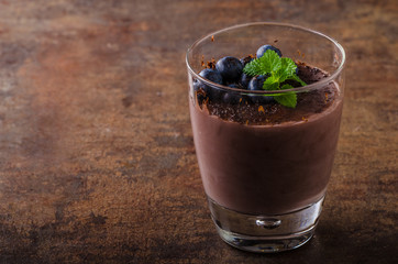 Chocolate pudding with berries and herbs