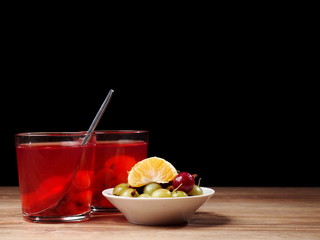 Homemade beverage made from garden berries and mandarin