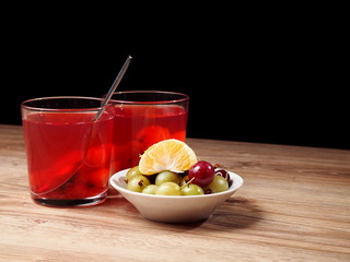 Homemade beverage made from garden berries and mandarin