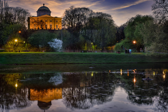 Królikarnia - a palace in Warsaw reflected in the lake, a dusk view