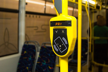 Cabin of city transport with yellow validator