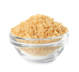 Heap of brown sugar in bowl, isolated on white
