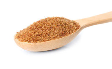 Heap of brown sugar in spoon, isolated on white