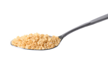 Heap of brown sugar in spoon, isolated on white