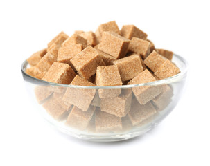 Heap of brown sugar in bowl, isolated on white