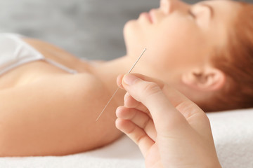 Woman body therapy. Acupuncturist holding needle, closeup - obrazy, fototapety, plakaty