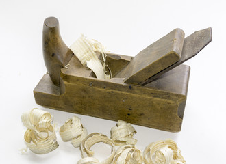 Old hand wood planer with shavings. Natural building materials. Woodwork and antique hand tools