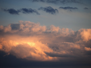 Blue sky with soft colorful clouds at the sunset background