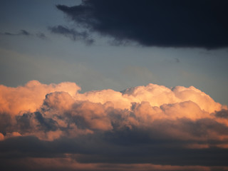 Blue sky with soft pink colorful clouds at the sunset background