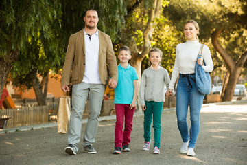 Family taking a walk in town