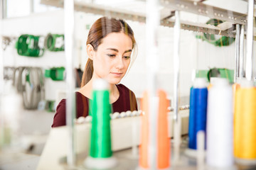 Woman using an embroidery machine