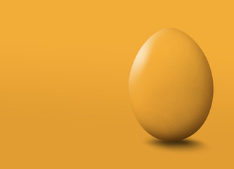 Yellow easter egg on yellow background.