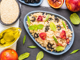 Vegan salad with quinoa, red orange and black olives