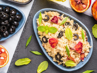Vegan salad with quinoa, red orange and black olives