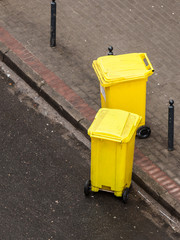 Plastic wheely bins in the street outside