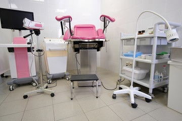 gynecological chair and other medical equipment in a gynecological office
