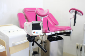 gynecological chair and other medical equipment in a gynecological office