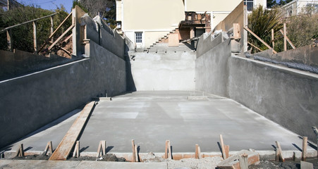 Front view of newly poured cement driveway.