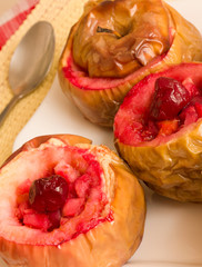 Baked homemade apples stuffed with cherries, vertical