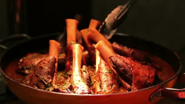 Delicious meat on bone in sause - luxury restaurant meal