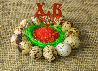 quail eggs are in a circle around the plastic blue bowl of red salt on a wooden table