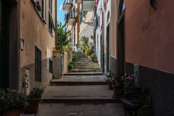 Fototapeta na wymiar Dark narrow street of Vernazza town, Italy