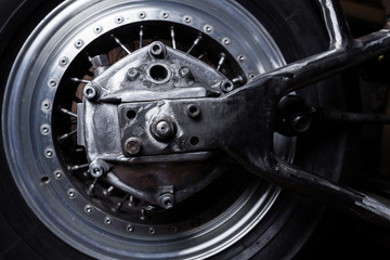 Motorcycle swingarm and wheel close-up