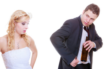 Bride having argument with drunk alcoholic groom