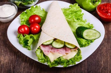 Burito with ham, cheese and cucumber