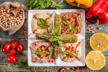 Mini-maza from hummus and vegetable dolma