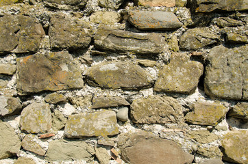 The texture of old stones together with cement.