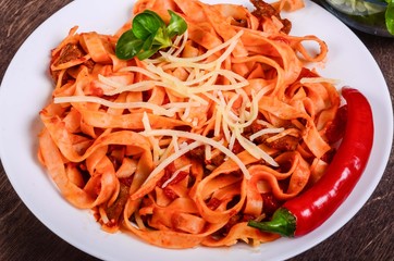 Chilli meat paste. Tagliatelle with beef and tomatoes