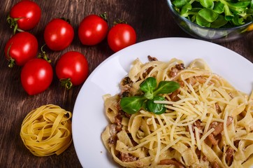 Pasta with seafood. Tagliatelle with squid