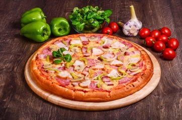 Pizza with bacon, ham, chicken and champignons