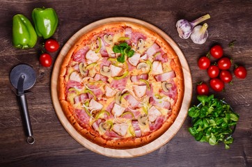 Pizza with bacon, ham, chicken and champignons