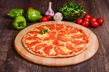 Thin pizza with tomatoes Margarita