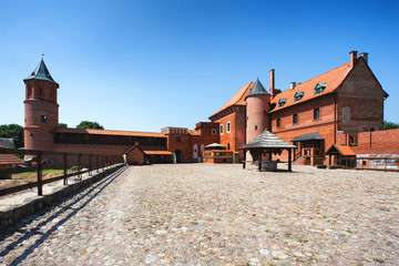 View of 15th century Gothic castle in Tykocin after the reconstruction work. The Castle located on the right bank of Narew river in Tykocin, Podlasie, Poland.