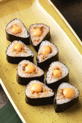 Sushi Roll with fish in a beautiful blue plate.