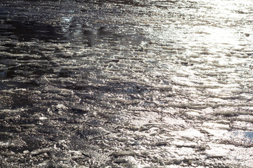 abstract reflections in melting the icy cobblestones